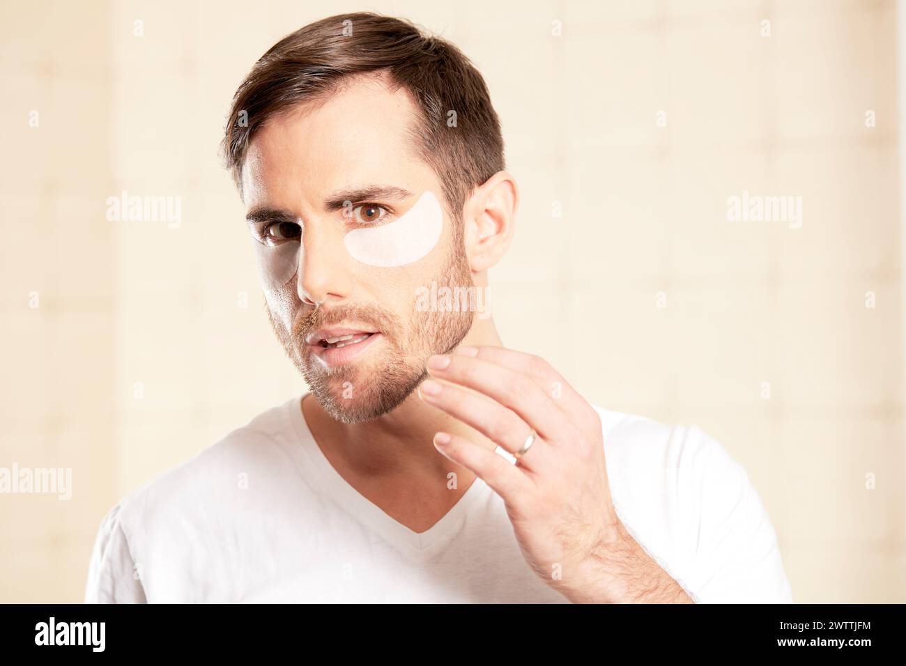 Man with facial skincare mask Stock Photo