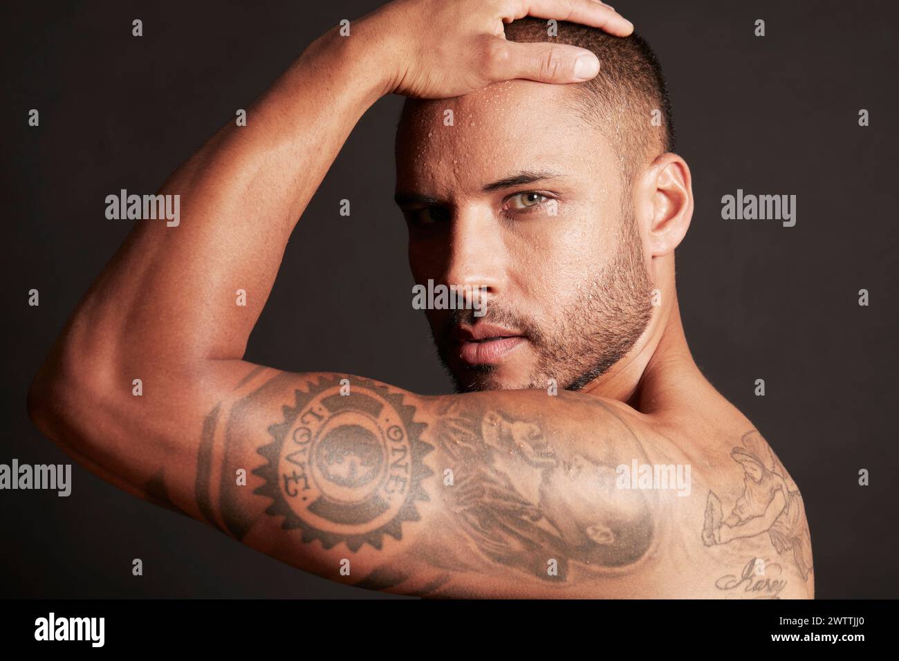 Man with tattoos posing Stock Photo