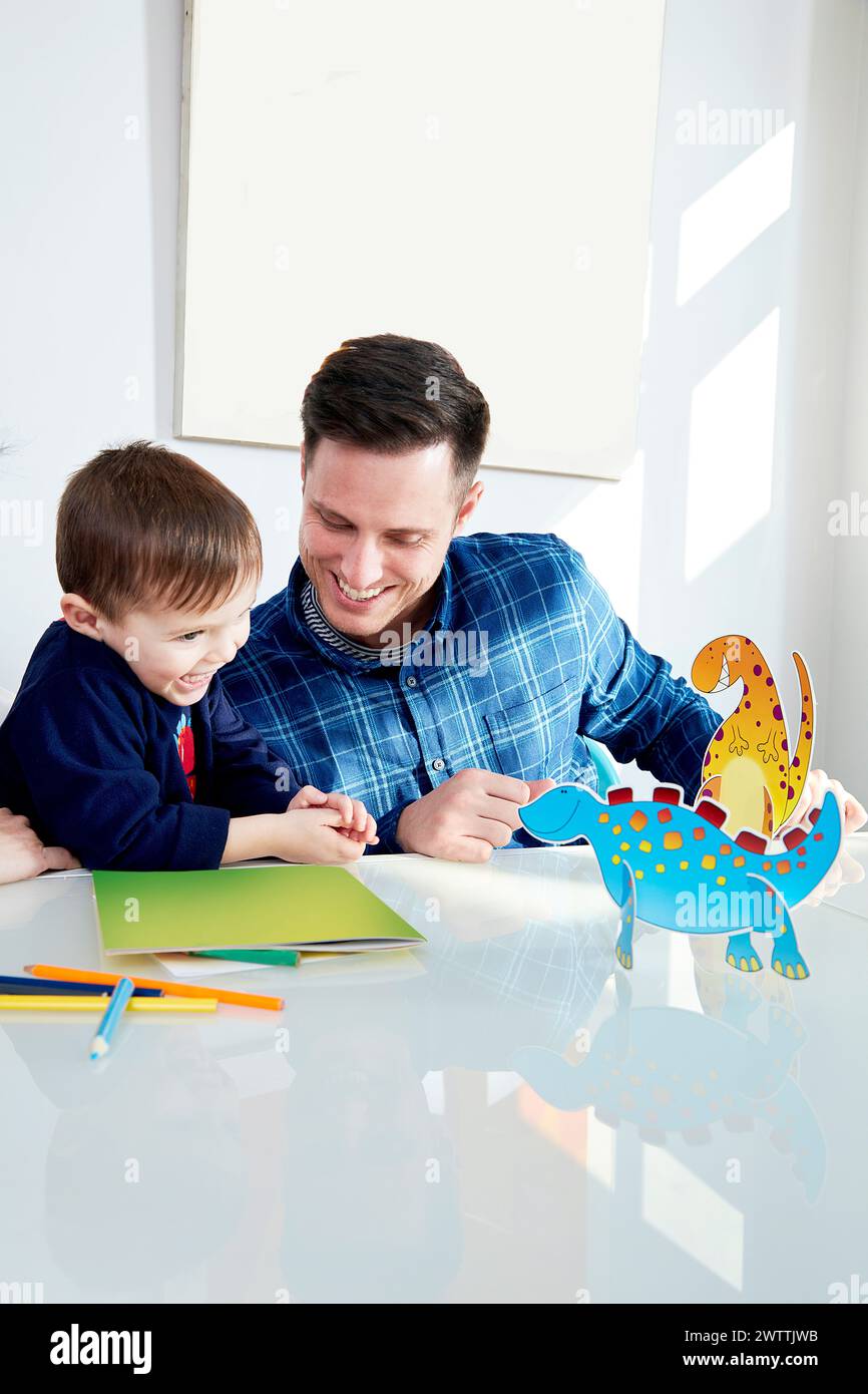 Father and son enjoying craft time together Stock Photo