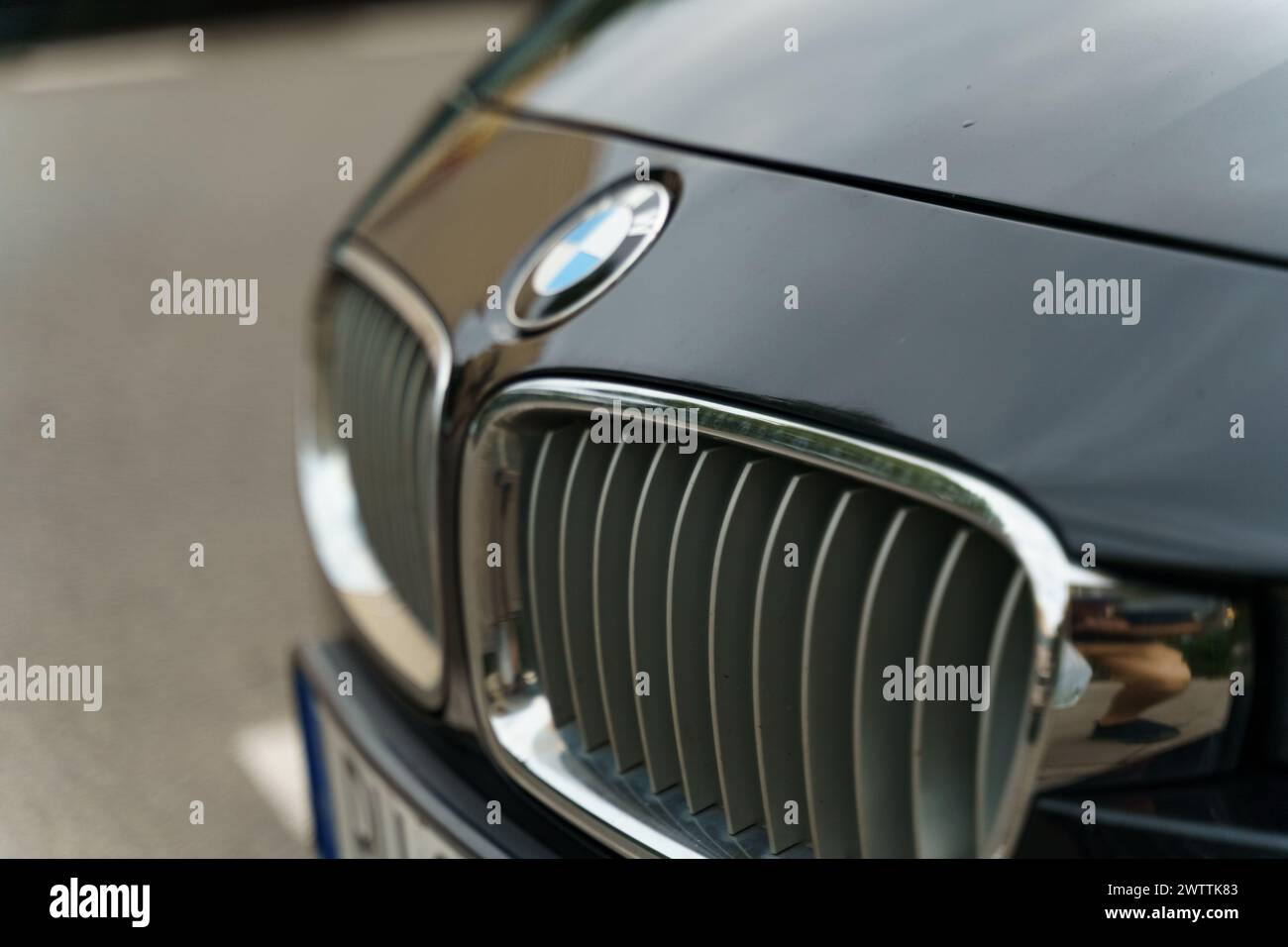Warsaw, Poland - August 6, 2023: BMW logo on the hood of a black car. Selective sharpening. Stock Photo