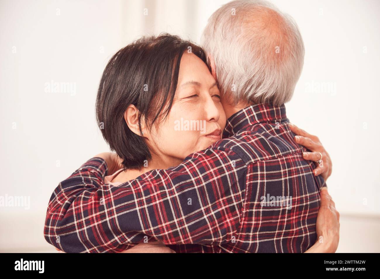 Warm embrace between two adults Stock Photo