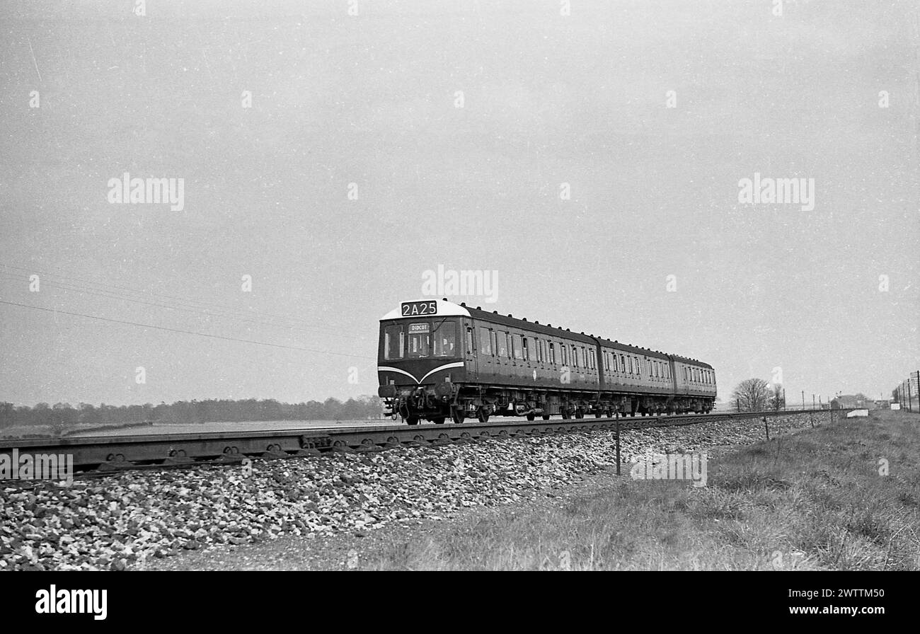 1960, historical, a diesel powered Class 117 train, marked 2A25 Didcot, on track, England, UK. The British Rail Class 117 was a DMU, a diesel multiple unit built by the Pressed Steel Company from 1959 to 1961. The trains were three-car sets and operated on the BR Western Region for suburban communting out of London Paddington. Stock Photo