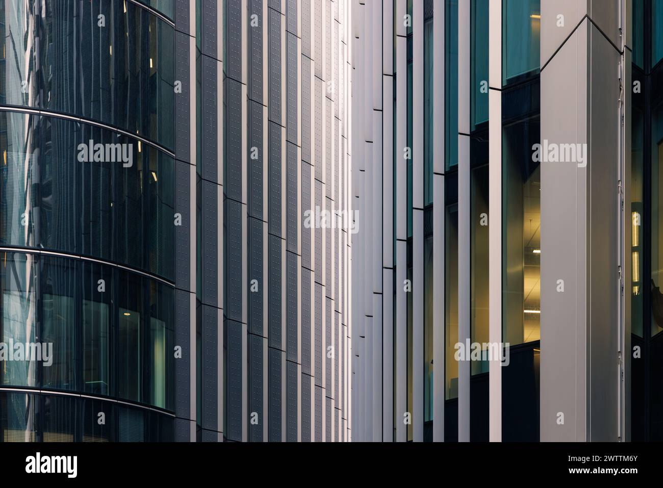 London, UK - February  2024: Two office blocks at 25 Fenchurch Avenue with vertical blade like architectural features seemingly touch each other. Stock Photo