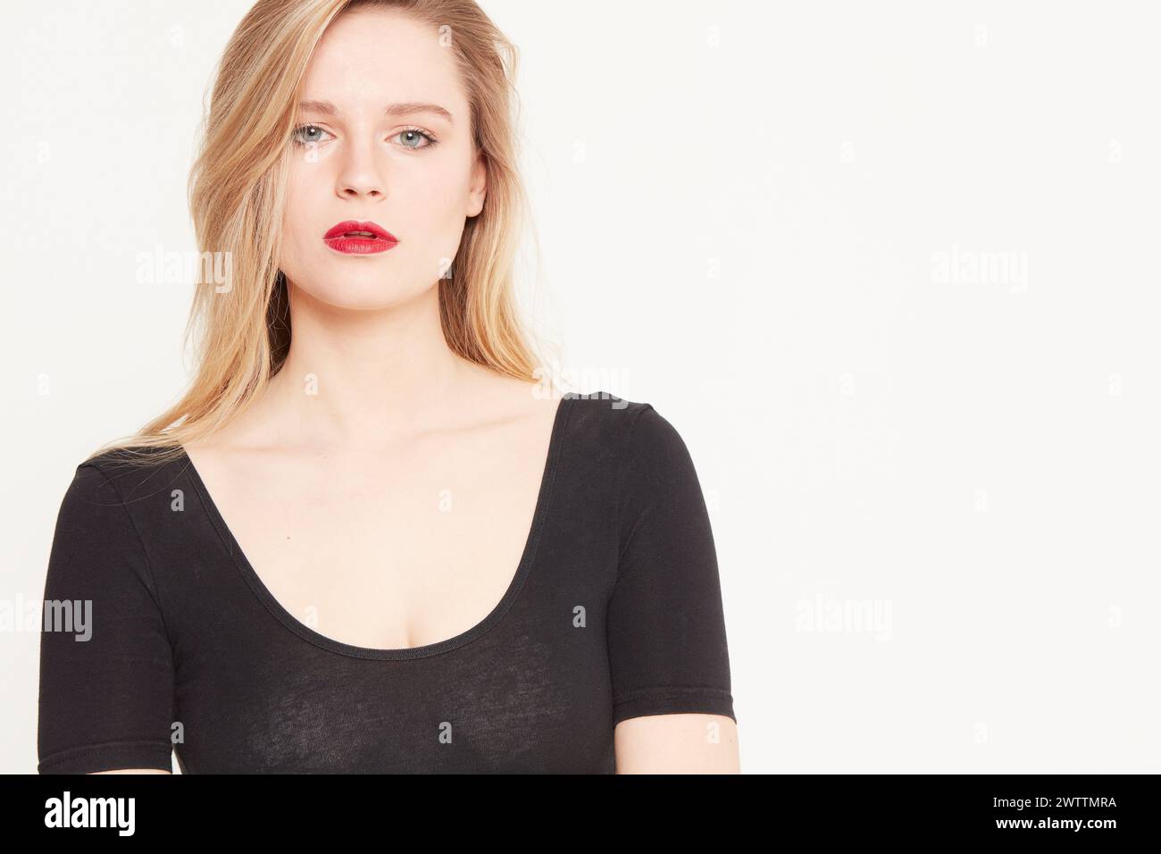 Woman with red lipstick in black top Stock Photo