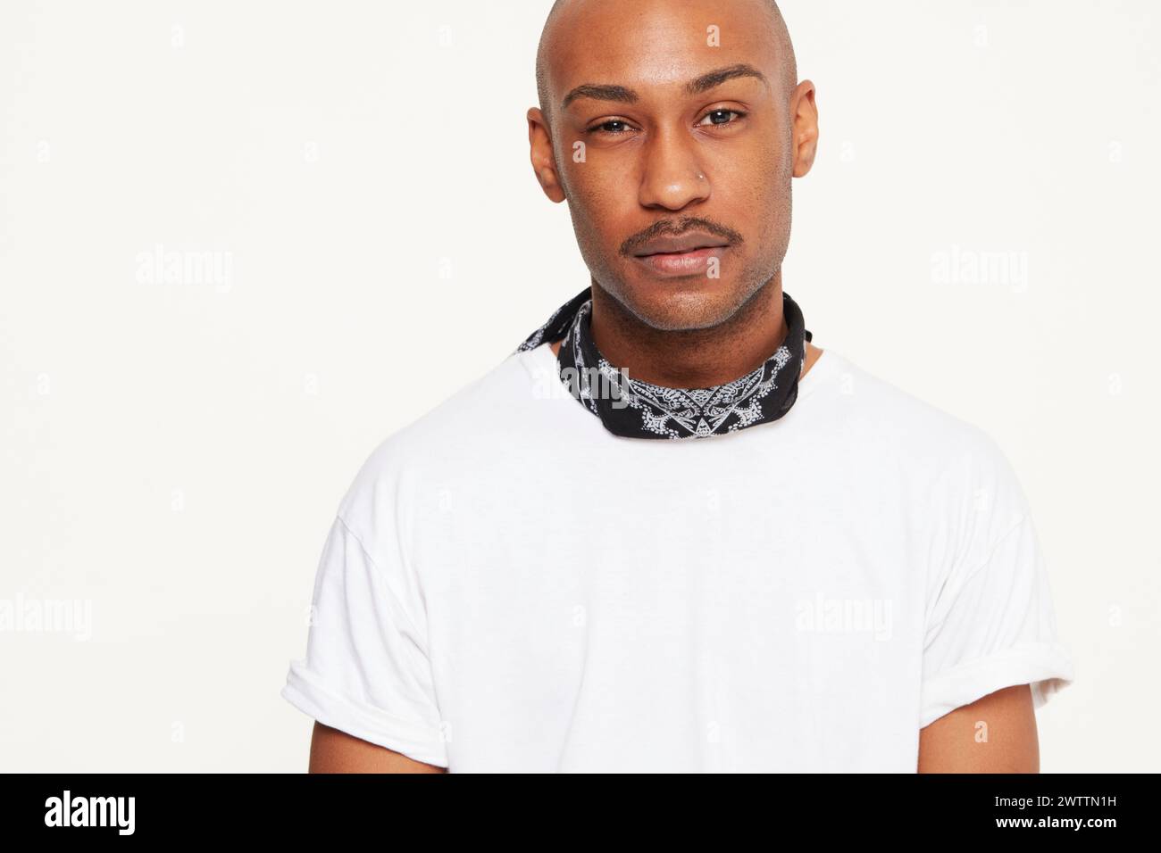 Man in white t-shirt with bandana Stock Photo