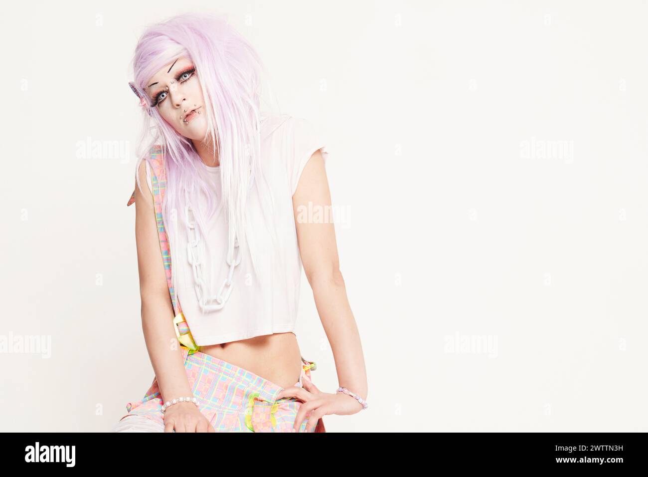 Alternative fashion model with pastel hair and piercings Stock Photo