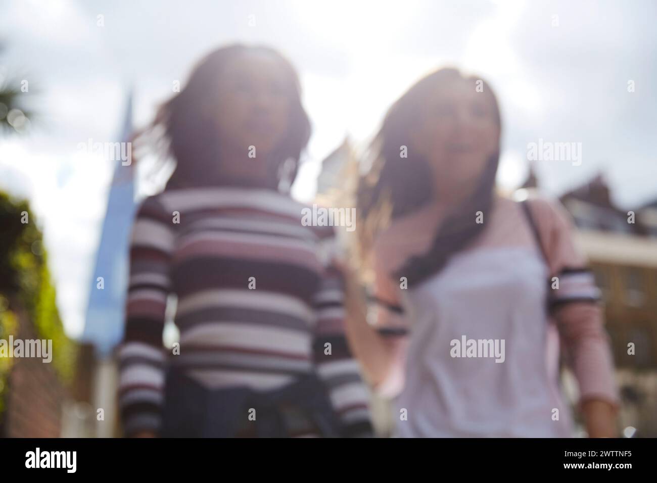 Blurred image of two individuals outdoors Stock Photo