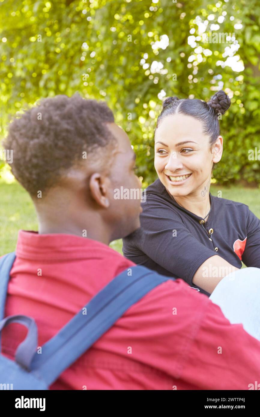 Two people enjoying a conversation outdoors Stock Photo