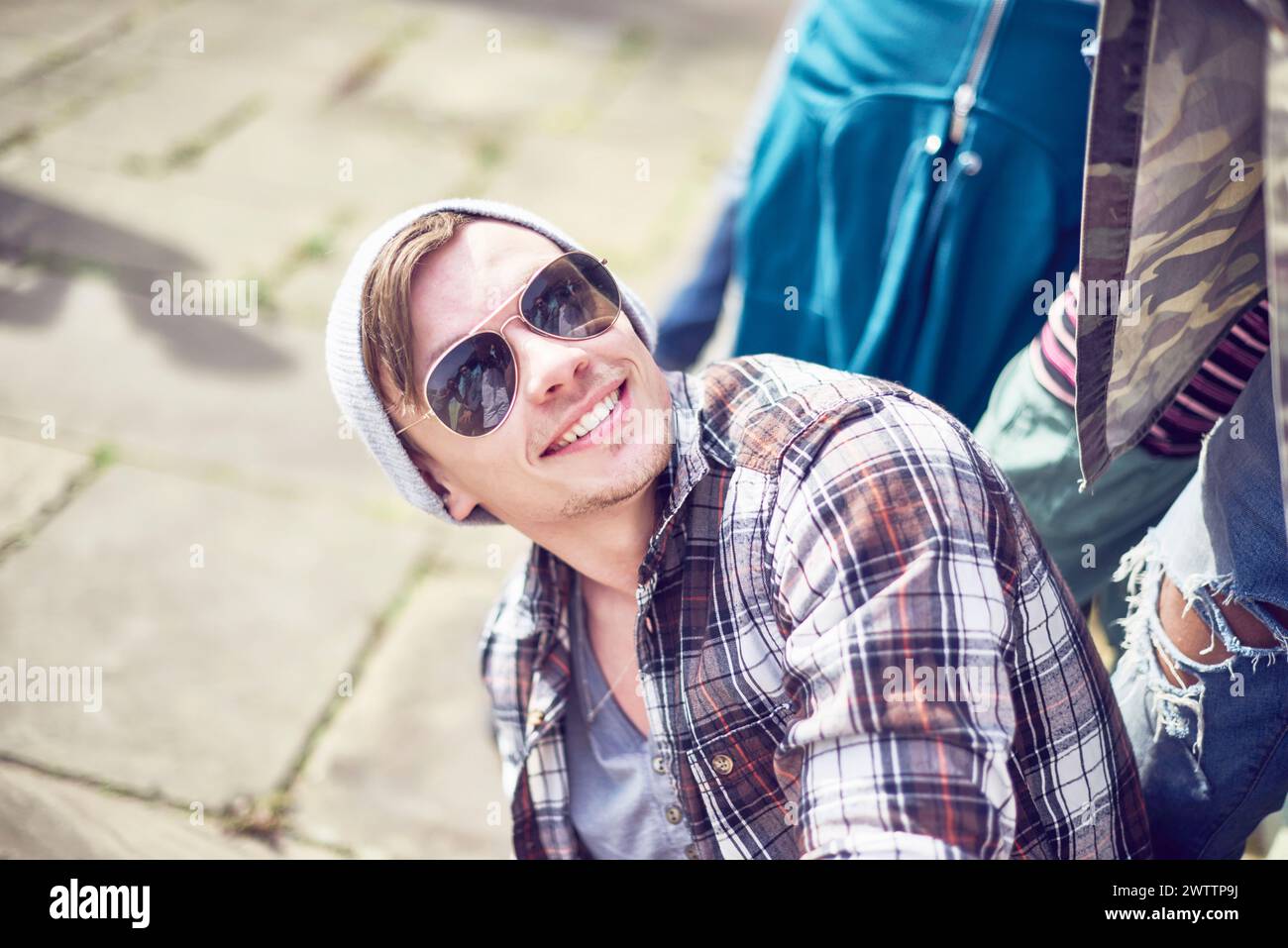 Smiling man with sunglasses outdoors Stock Photo