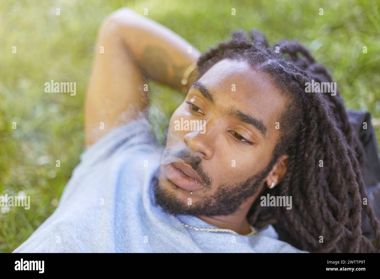 Man relaxing on the grass Stock Photo