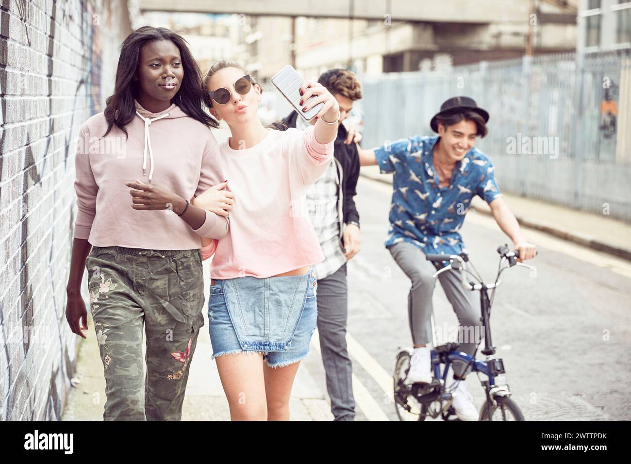 Friends taking a selfie on an urban street Stock Photo