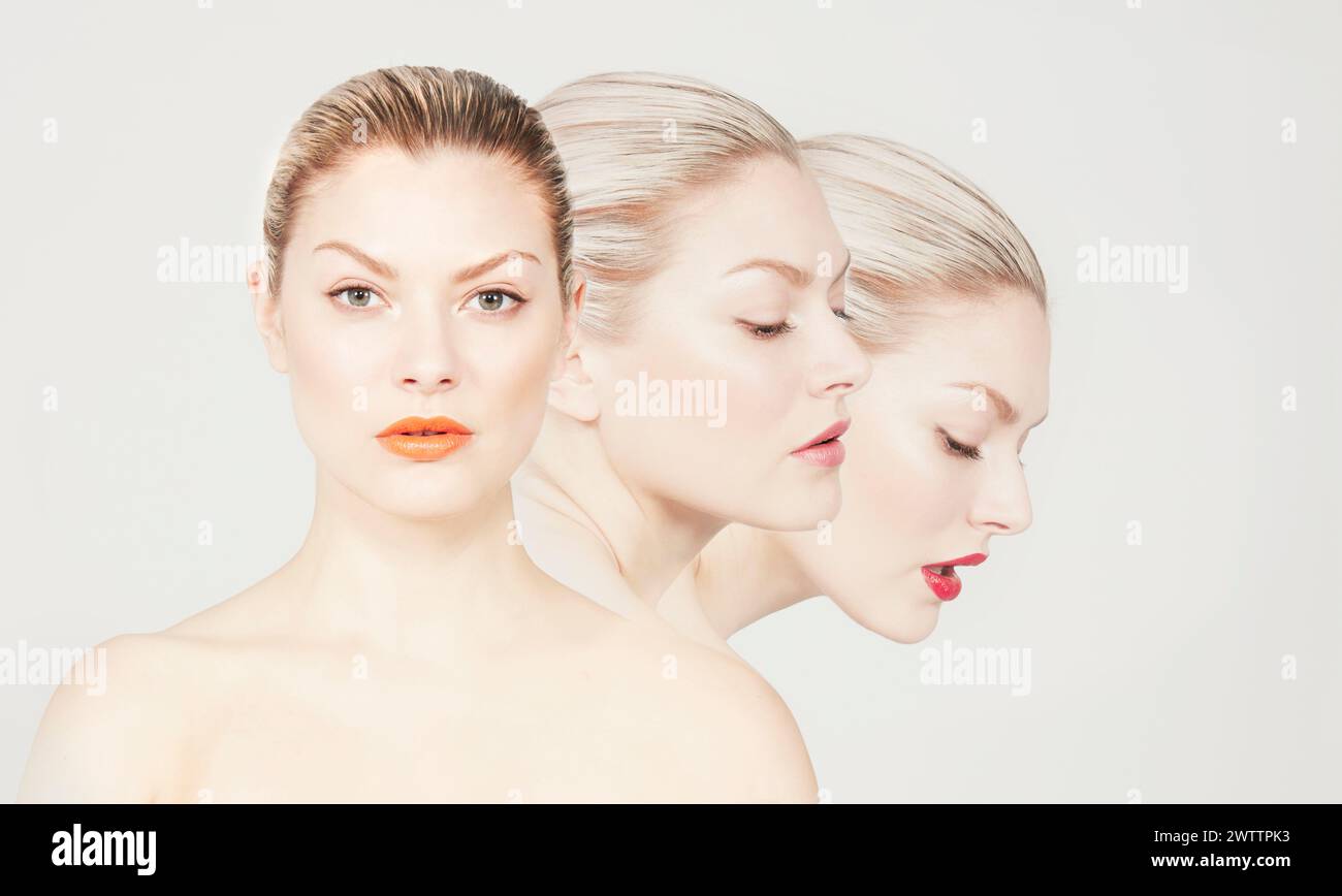 Three women with distinct makeup and expressions Stock Photo
