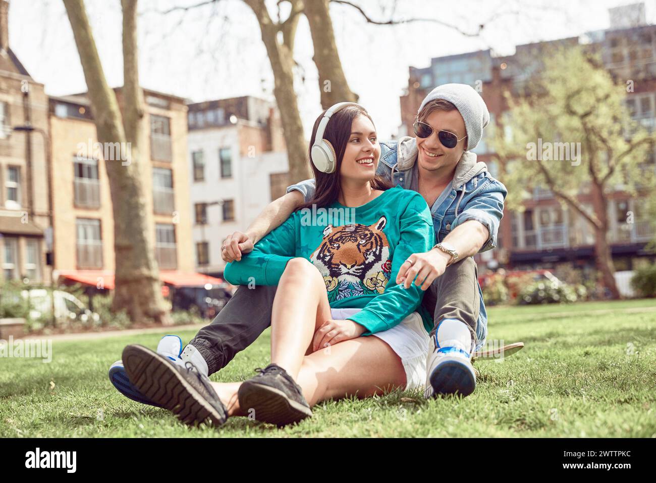 Couple relaxing in a sunny park Stock Photo