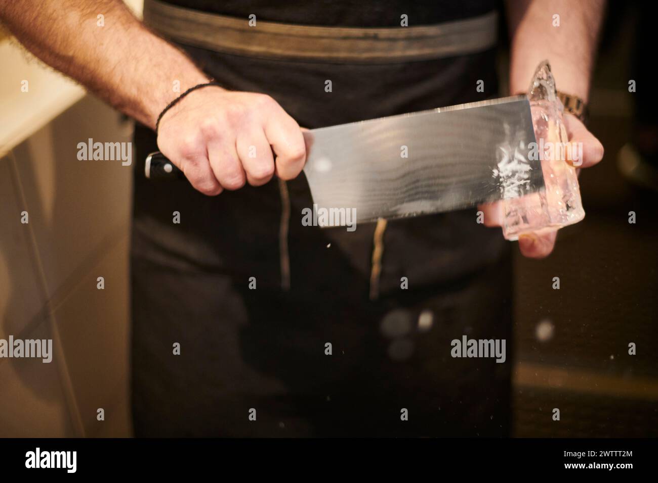 Chef holding a large kitchen knife Stock Photo