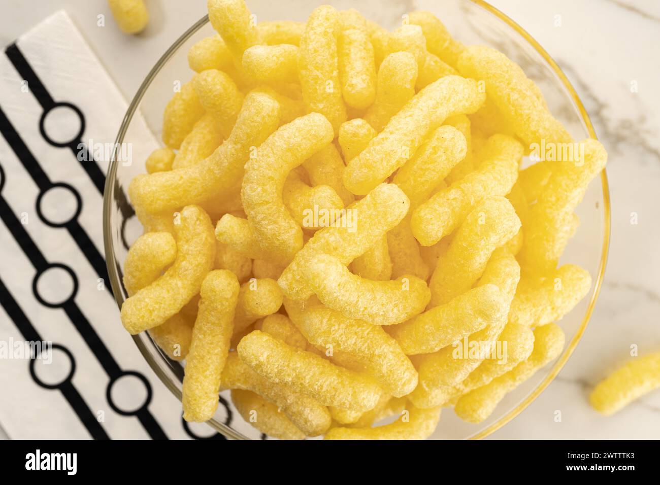 Corn sticks in bowl on table still life. Top view Stock Photo