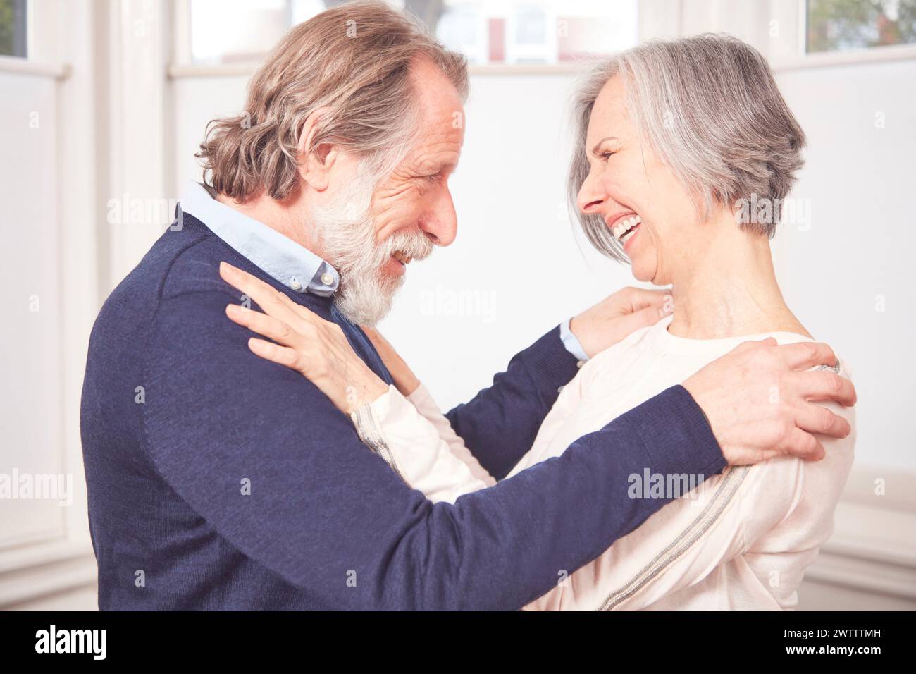Elderly couple sharing a joyful moment Stock Photo