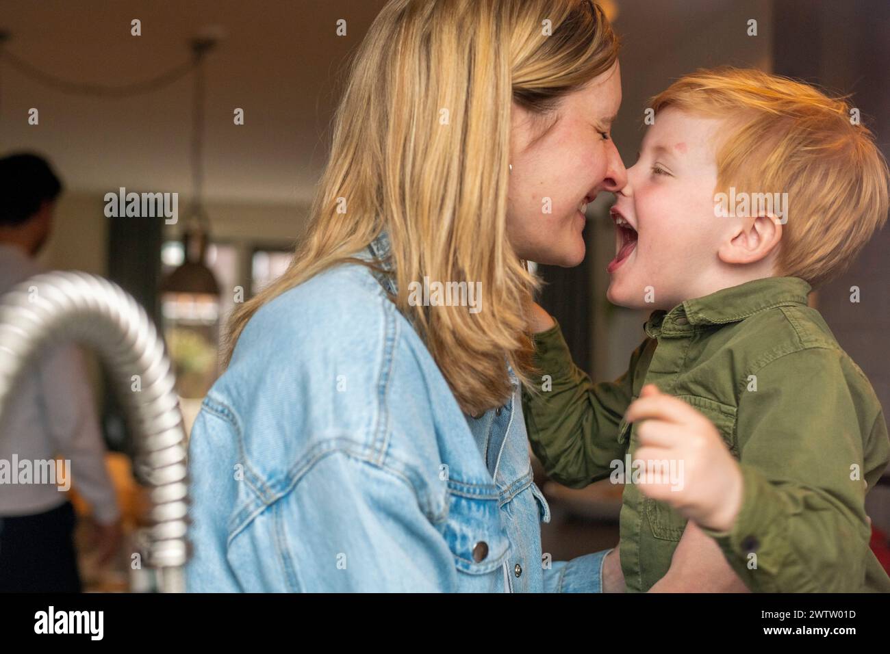 Joyful moment as a mother and son share a laugh together Stock Photo