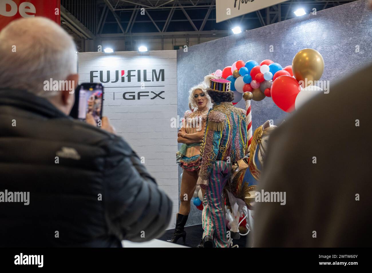 Birmingham, England, UK. Tuesday 19th March 2024. Models at the Fujifilm stand. Credit: Lu Parrott/Alamy Live News Stock Photo