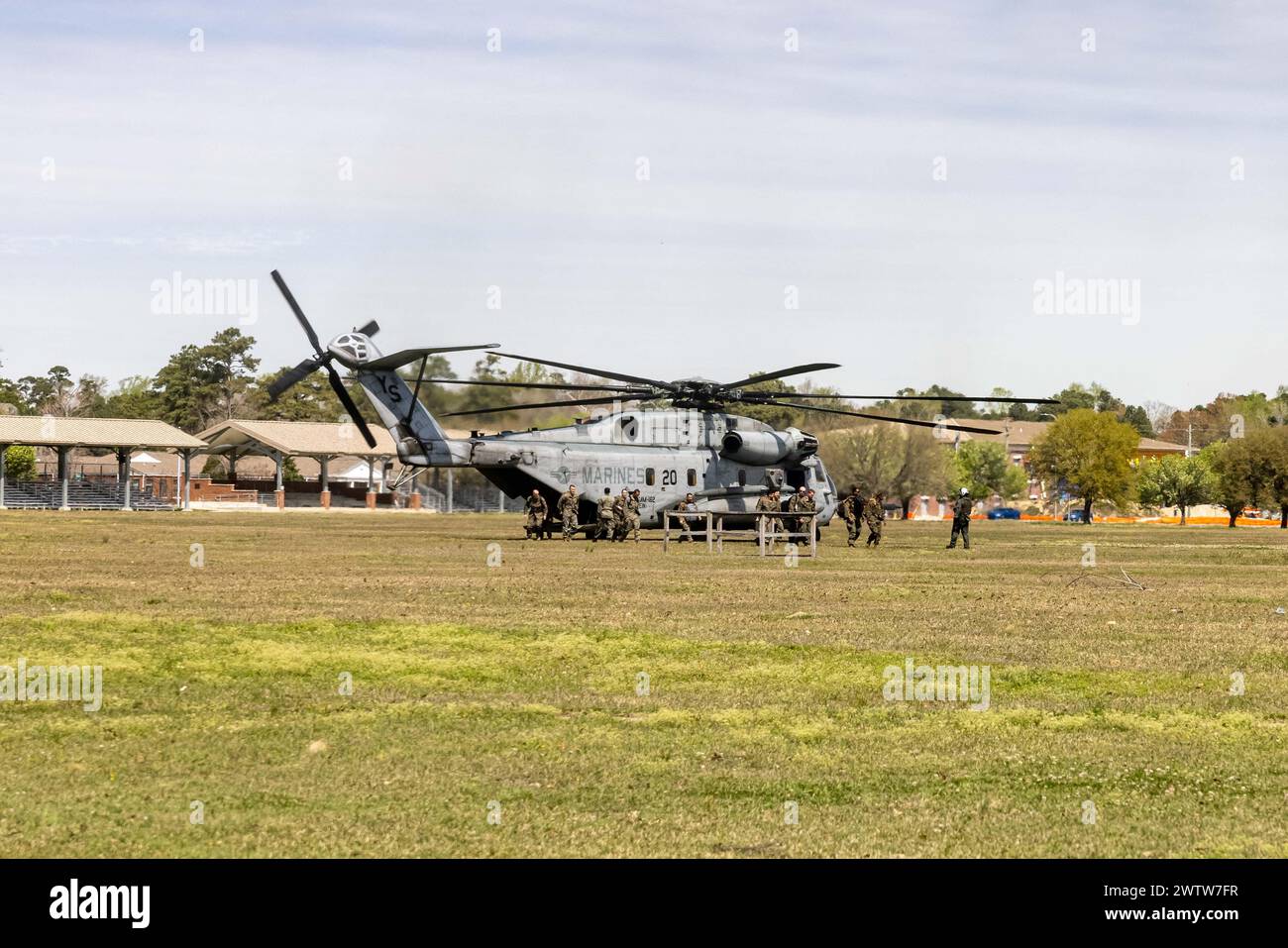 U.S. Marines with the 26th Marine Expeditionary Unit (Special Operations Capable) (MEU(SOC))’s command element unload from a CH-53E Super Stallion after arriving at Camp Lejeune, North Carolina, Mar. 18, 2024. Marines and Sailors assigned to the 26th MEU(SOC) returned home after completing an eight-month deployment embarked aboard the Bataan Amphibious Ready Group (BAT ARG). During its deployment, the BAT ARG and 26th MEU(SOC) team participated in a wide array of exercises with NATO Allies and regional partners spanning across the Tri-Geographic Combatant Command to enhance interoperability, M Stock Photo
