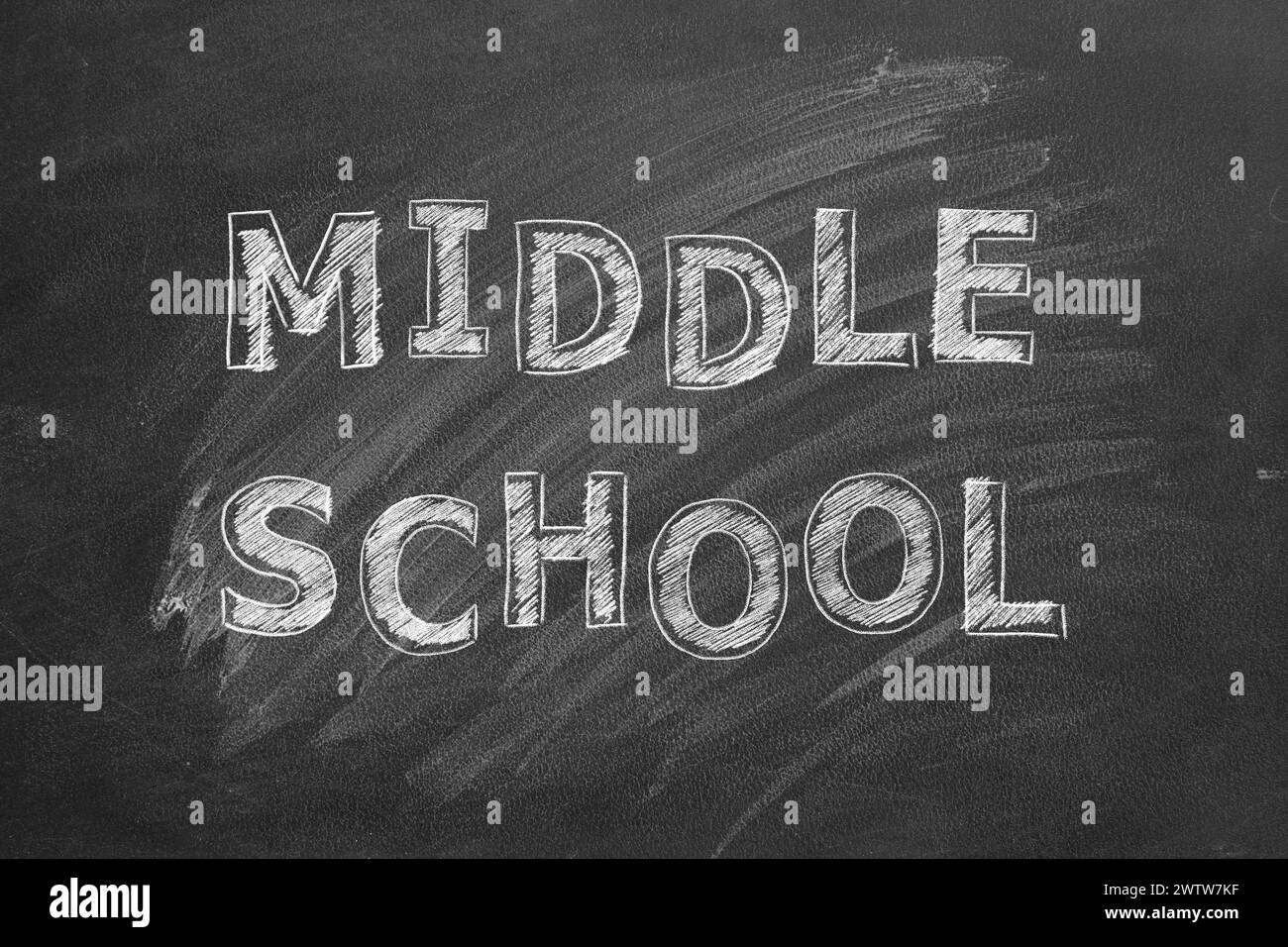 Lettering MIDDLE SCHOOL on black chalkboard. Stock Photo