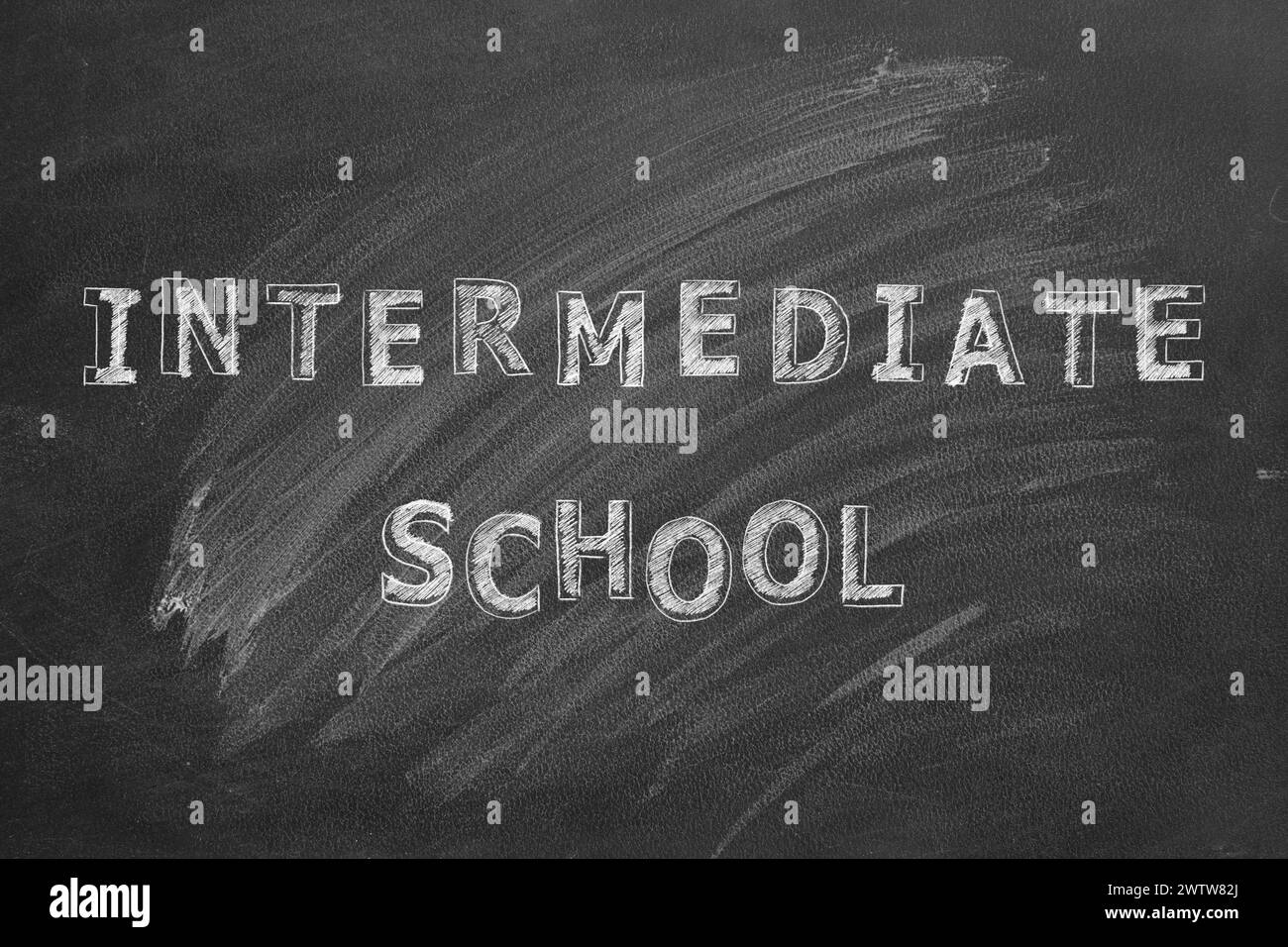 Lettering Intermediate school on black chalkboard. Stock Photo