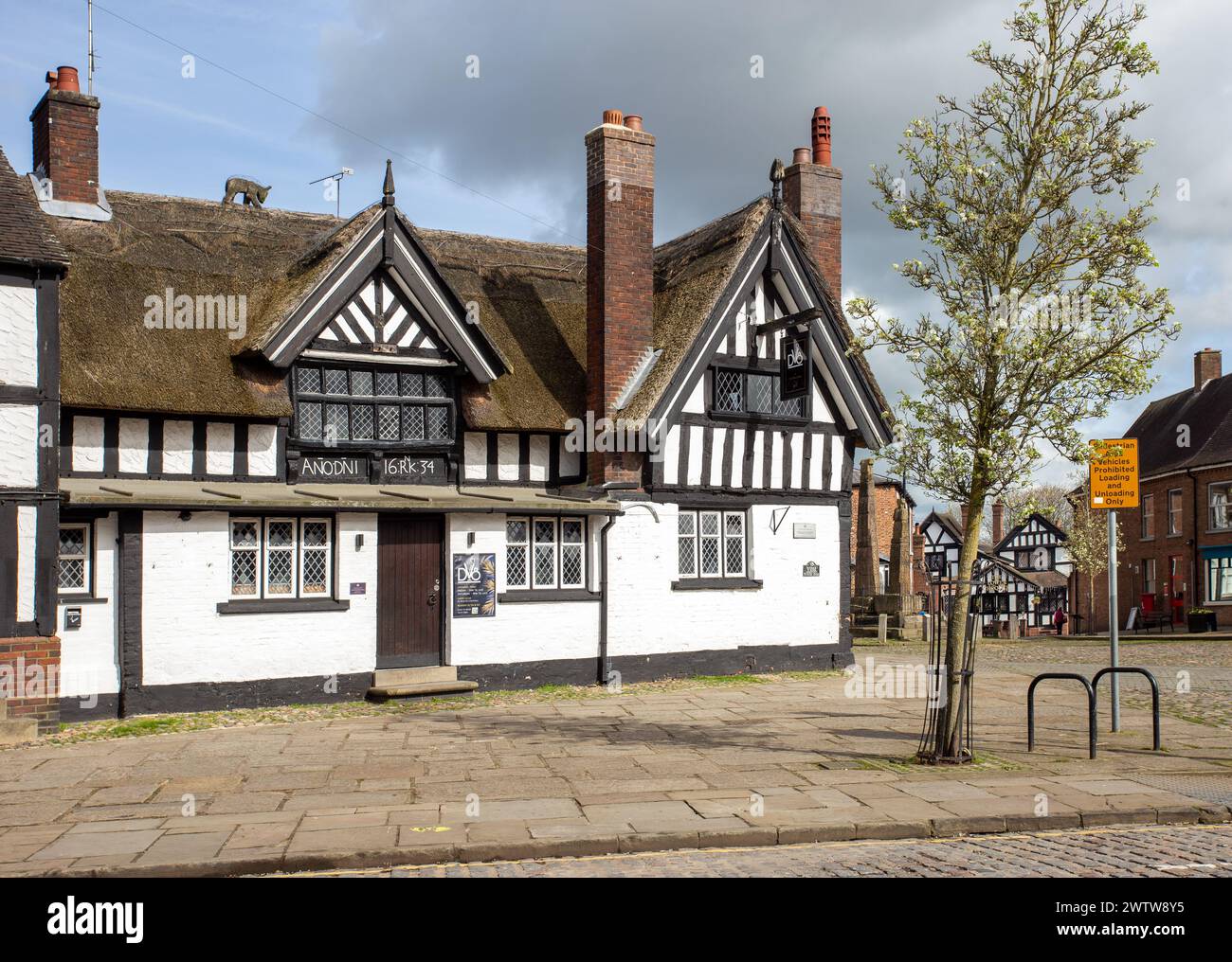 Black and white half timbered thatched roof coaching inn the Black Bear ...