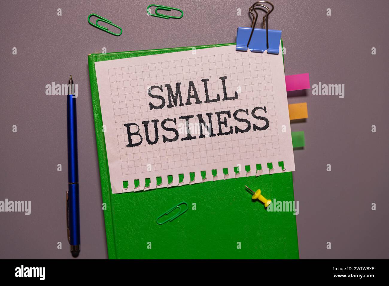 Small Business Saturday typography text on the blackboard set on wooden floor and brick background Stock Photo