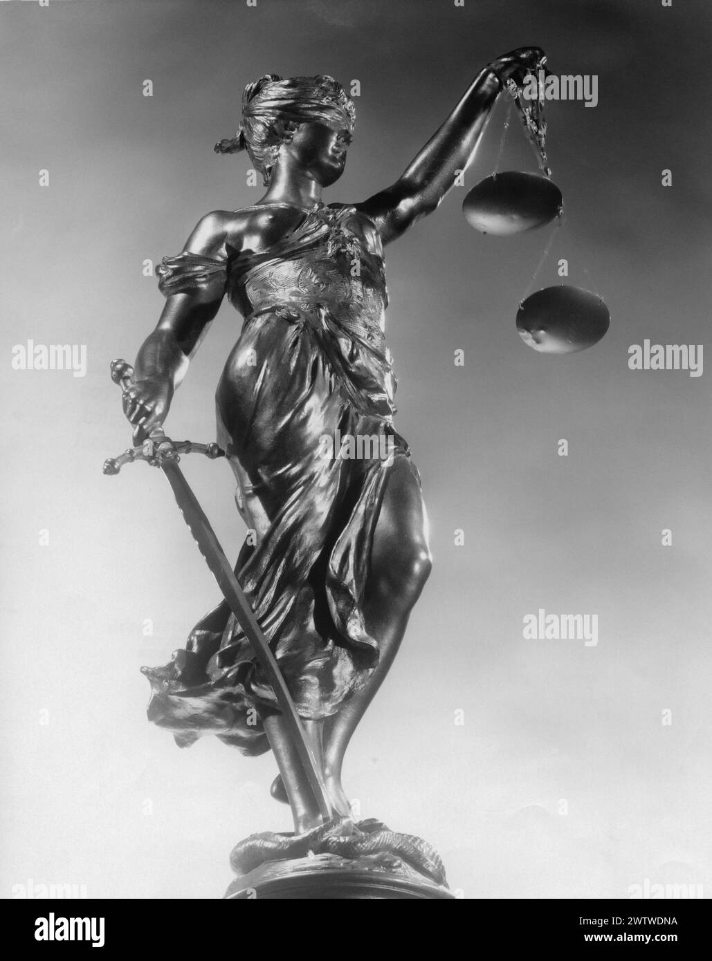 Close up of a statue of Lady of Justice, blindfolded holding scales and a sword Stock Photo