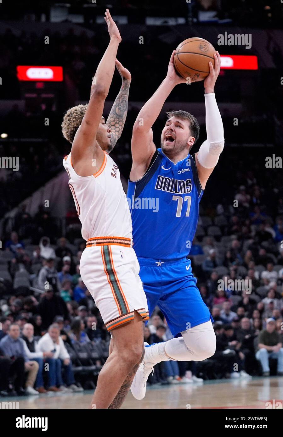 Dallas Mavericks guard Luka Doncic (77) shoots over San Antonio Spurs ...