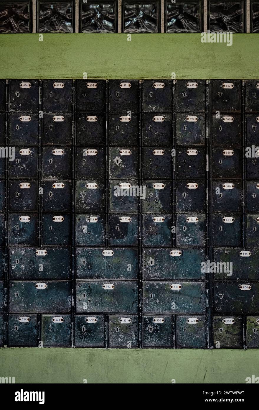 A grungy array of metal post boxes, hinting at nostalgia and the era of snail mail communication Stock Photo