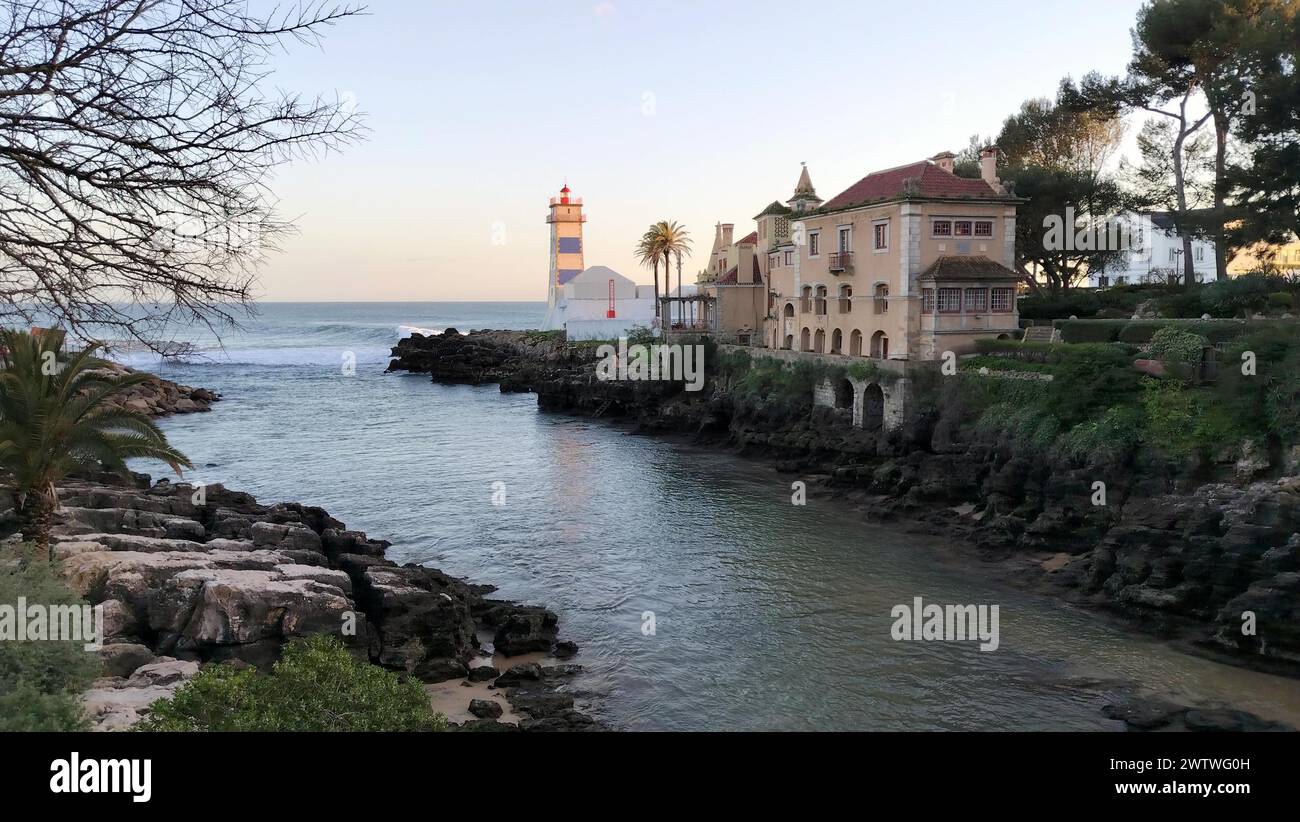 Santa Marta Lighthouse, built on the grounds of the Santa Marta Fort, which now houses a lighthouse museum, view in sunset light, Cascais, Portugal Stock Photo