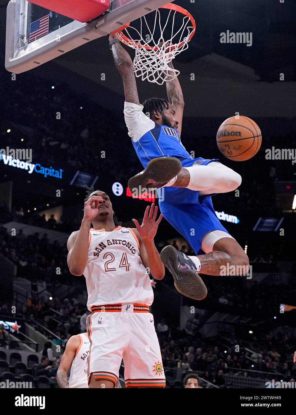 Dallas Mavericks forward Derrick Jones Jr., right, dunks over San ...