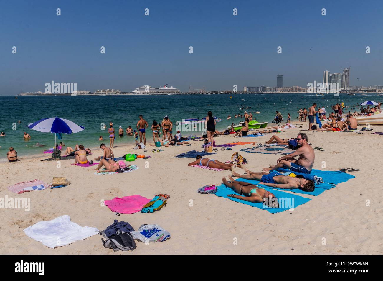 DUBAI, UAE - OCTOBER 30, 2021: People at Marina Beach in Dubai, United Arab Emirates. Stock Photo