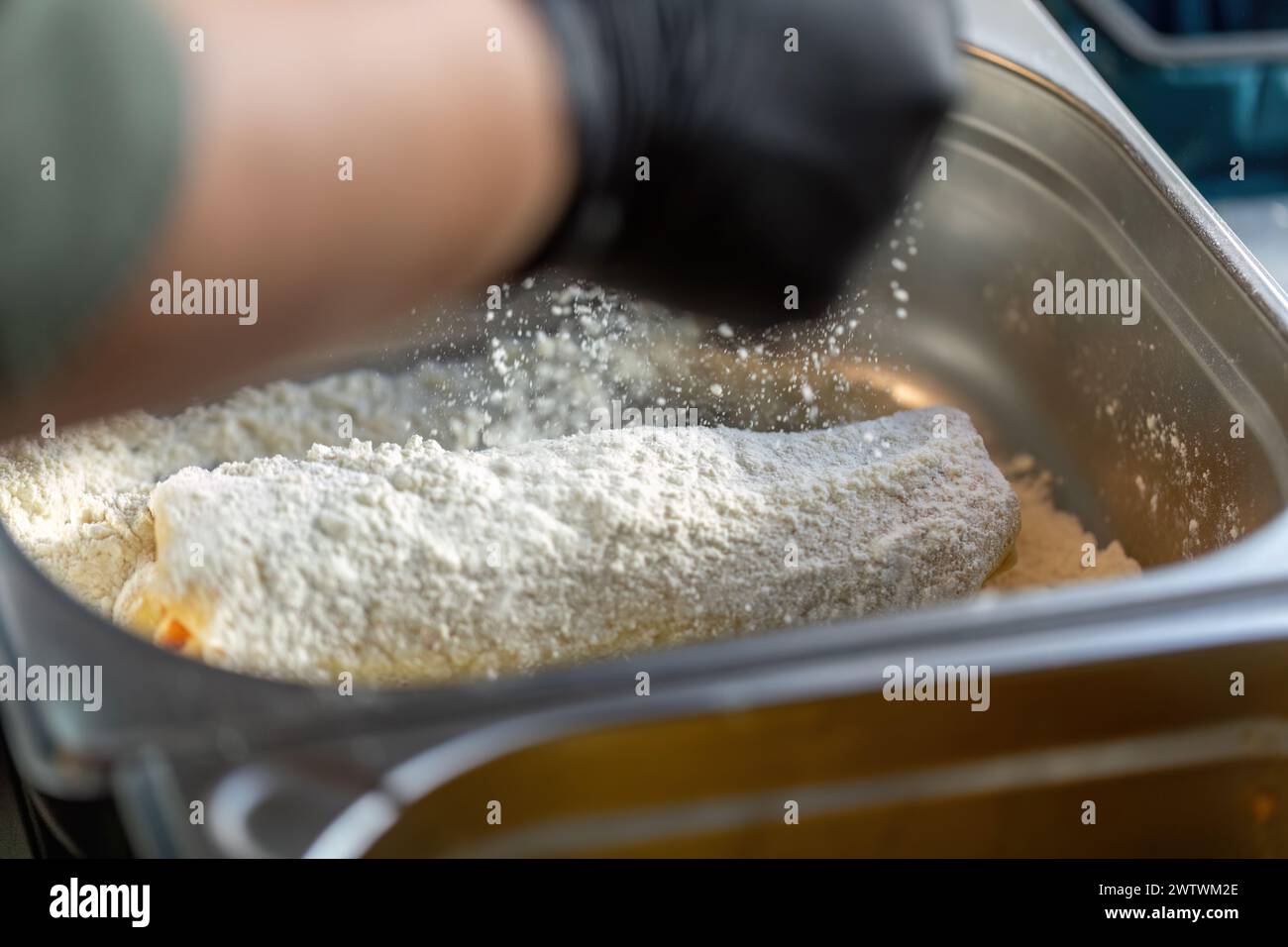 Authentic breading process of a cordon bleu schnitzel Stock Photo - Alamy