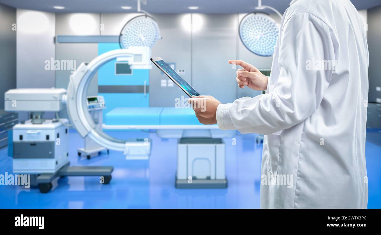 Doctor with graphic interface display in 3d rendering hospital room with medical machine Stock Photo