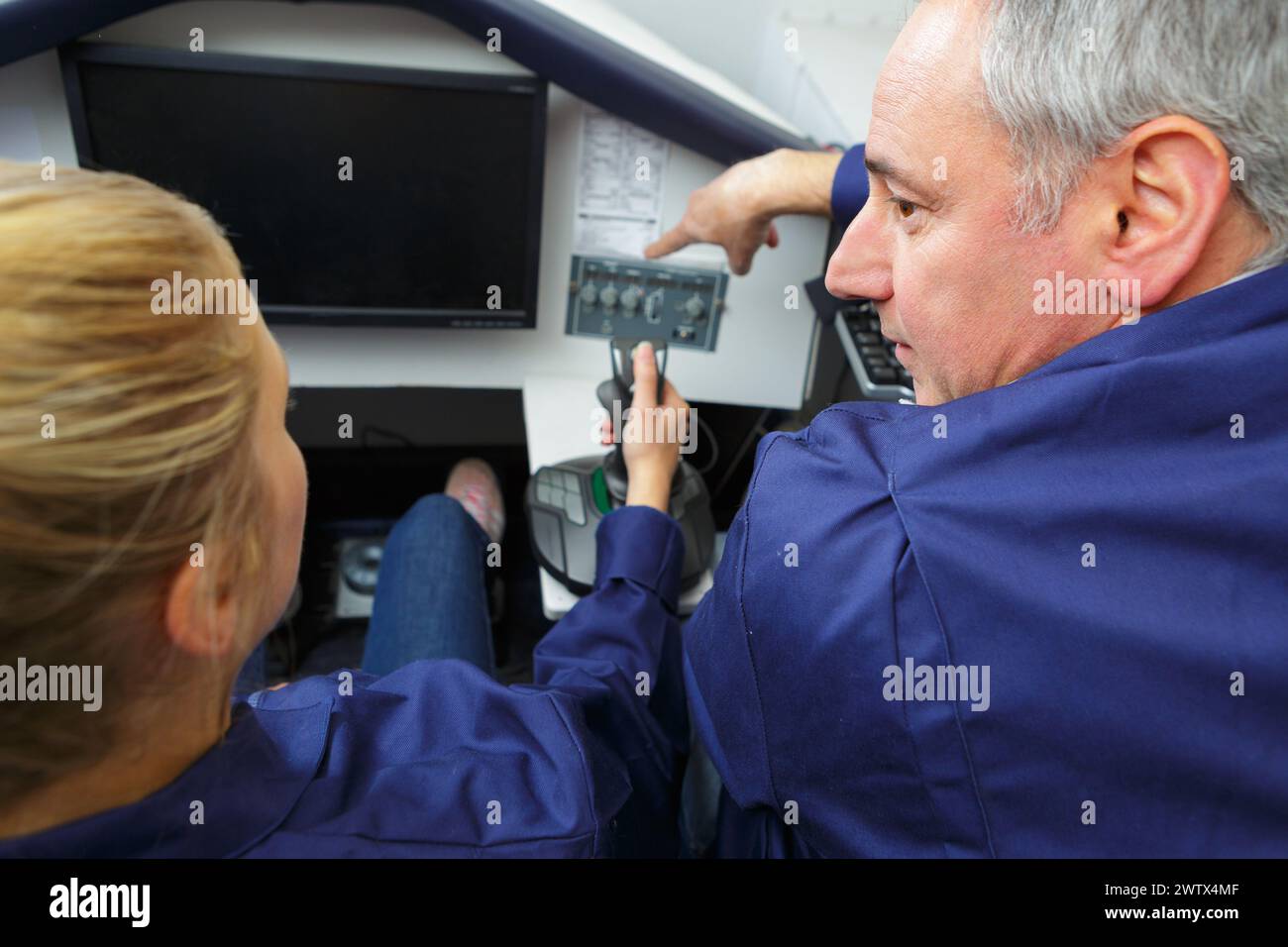 she is using a computer simulator Stock Photo