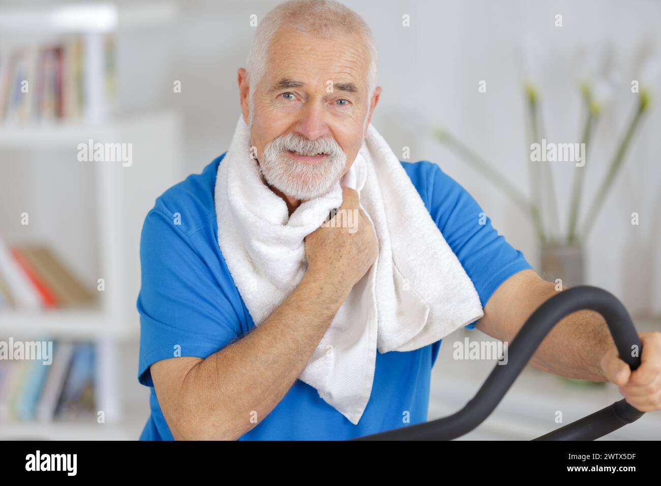 senior man exercising on stepper Stock Photo