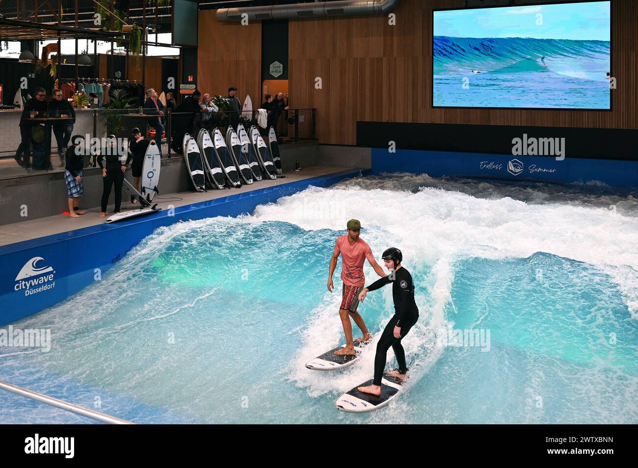 Artificial wave in the indoor surf hall RheinRiff in Düsseldorf, Germany Stock Photo