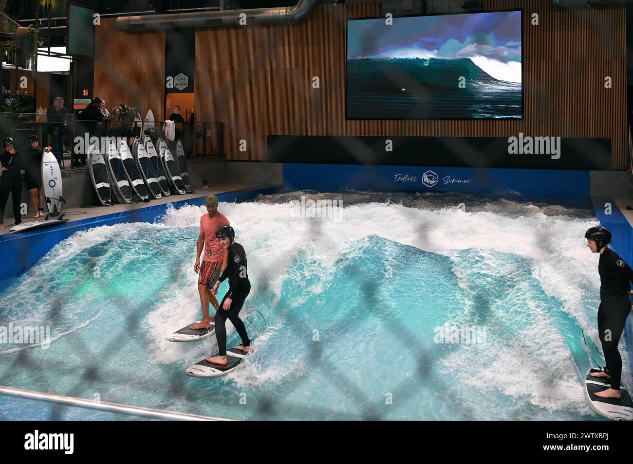 Artificial wave in the indoor surf hall RheinRiff in Düsseldorf, Germany Stock Photo