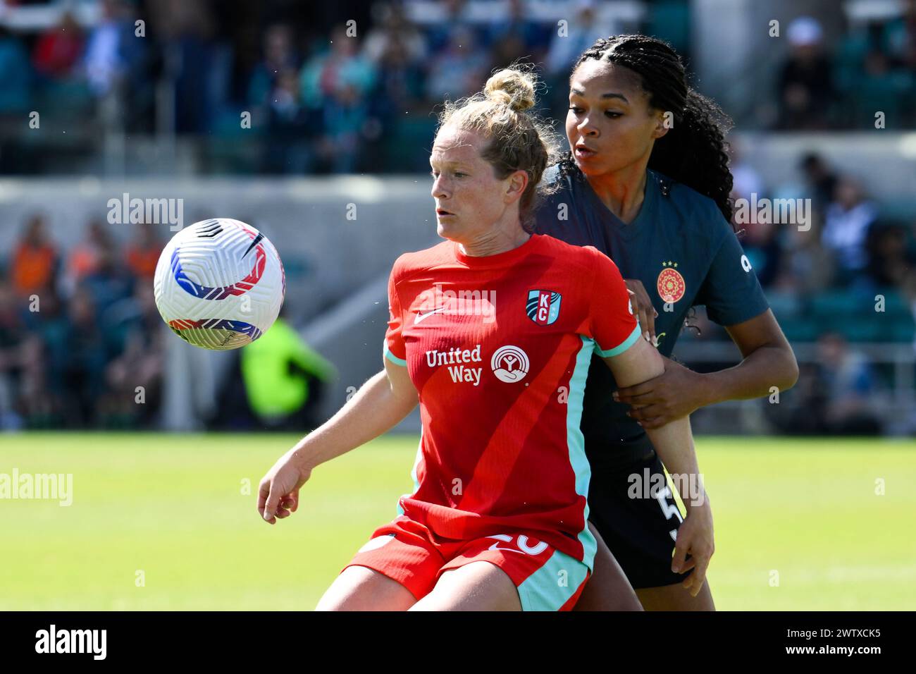Kansas City Current defender Mallory Weber, left, and Portland Thorns