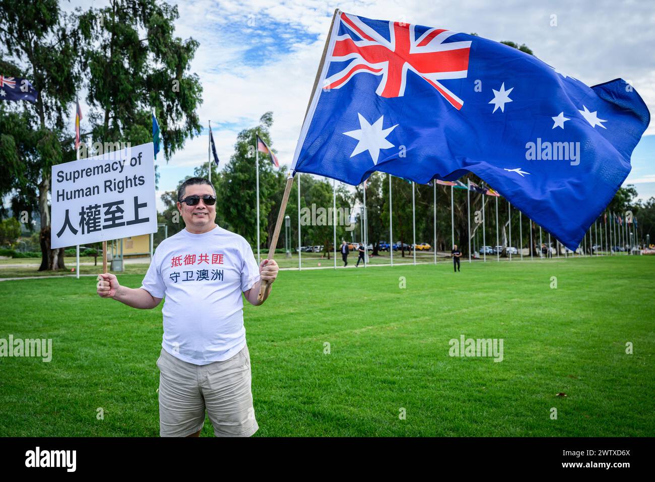 a-protester-holds-a-supremacy-of-human-rights-placard-and-the