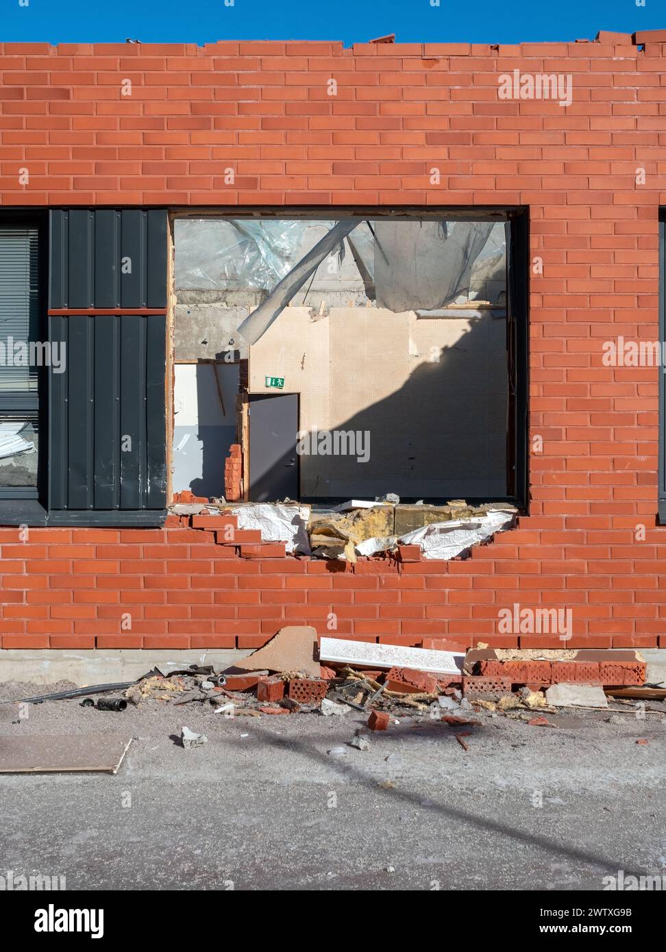 Demolition of a red brick building Stock Photo