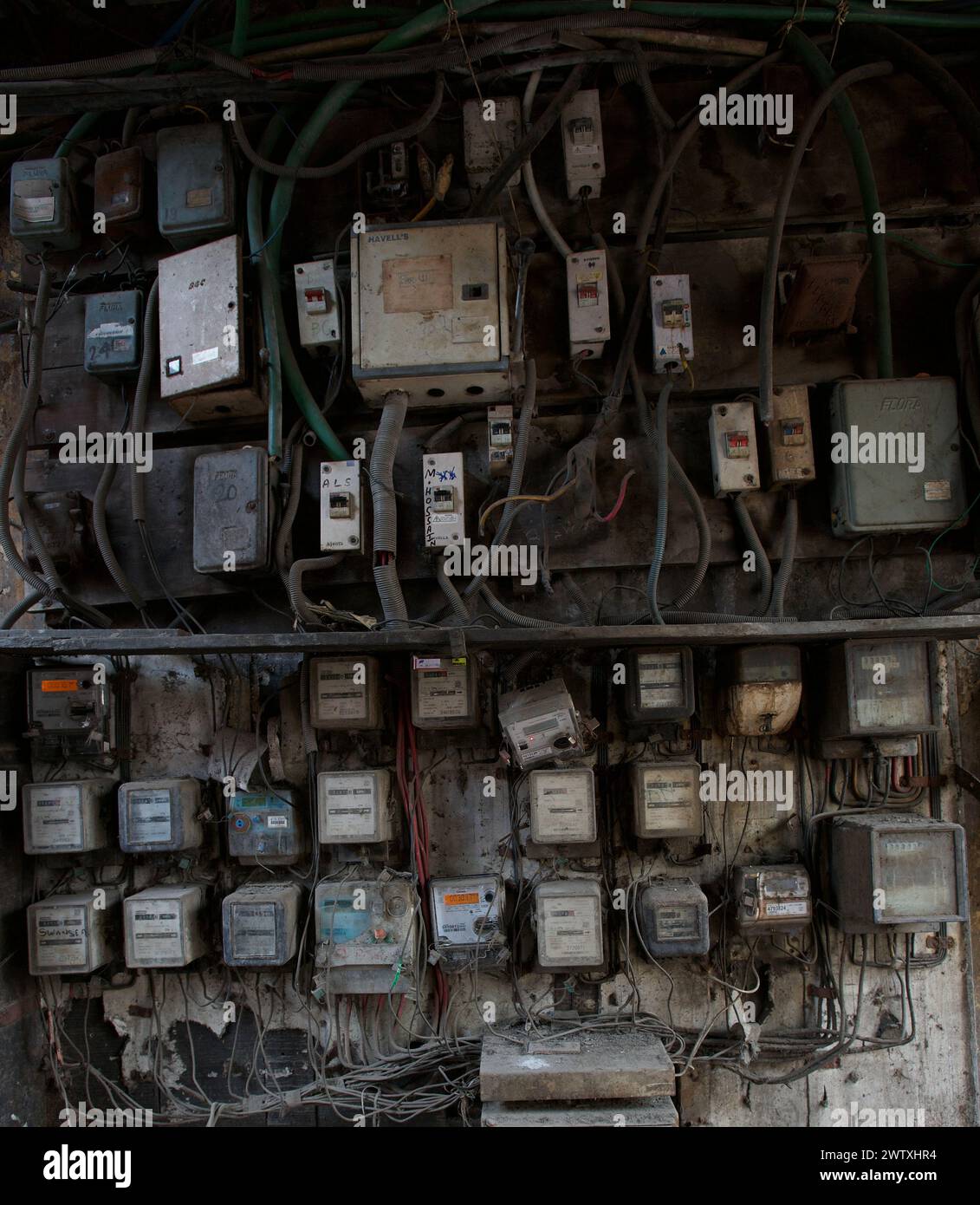Electricity meters on the wall of an entrance of a building,Kolkata, India Stock Photo