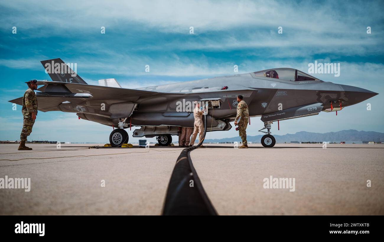 U.S. Air Force Staff Sgt. Roman Thomas (right), 56th Component Maintenance Squadron F-35A maintenance instructor, trains U.S. Marine Cpl. Thomas Hawle Stock Photo