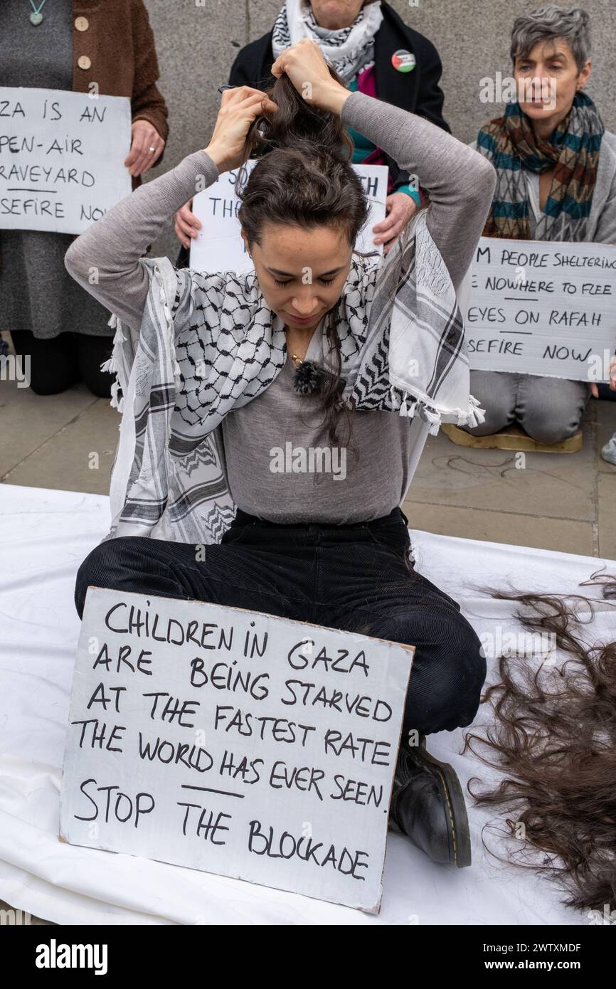 London, UK, 19th, March 2024. Activist shave their heads outside the Houses Of Parliament in solidarity with women of Gazza.  Credit: James Willoughby Stock Photo