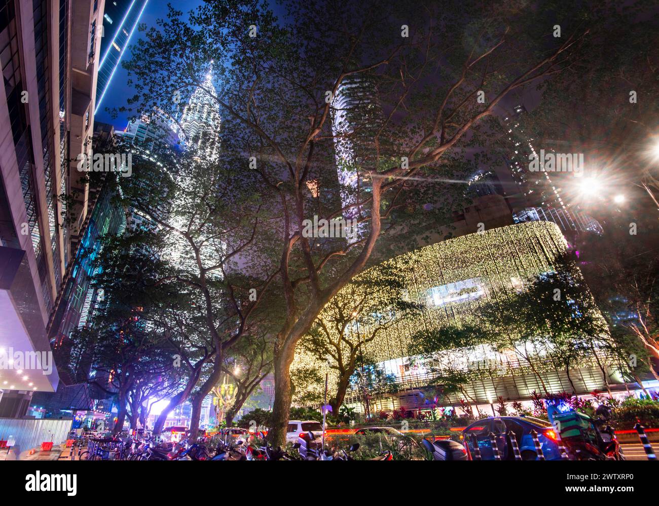 Clouds illuminated by bright lights from high buildings,busy bustling ...