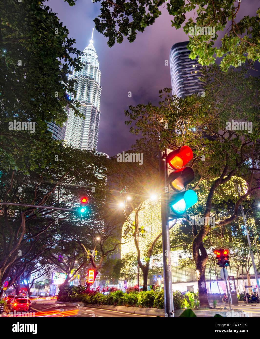 Clouds illuminated by bright lights from high buildings,busy bustling ...