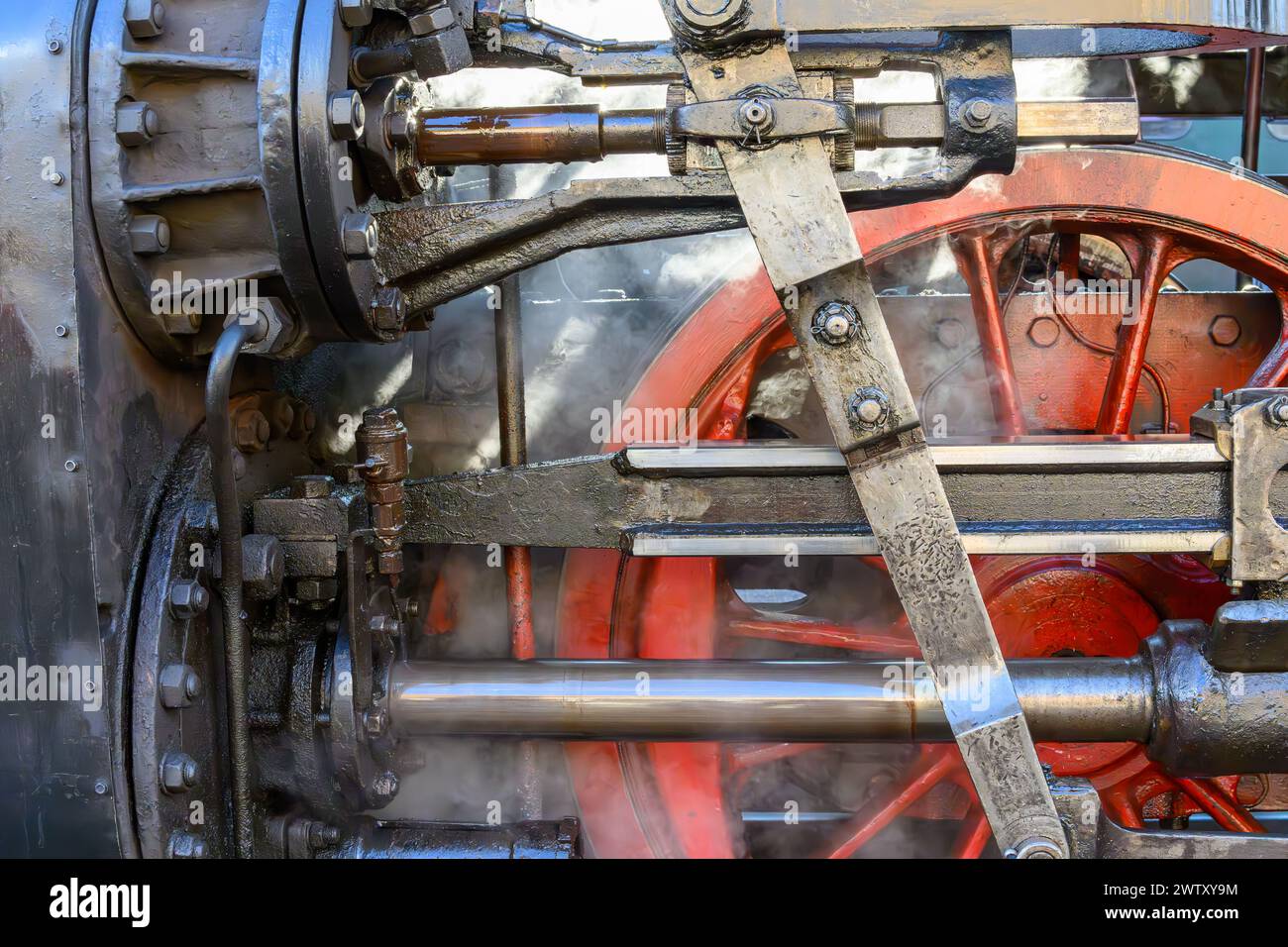 A linkage of an old steam locomotive with a red wheel Stock Photo - Alamy