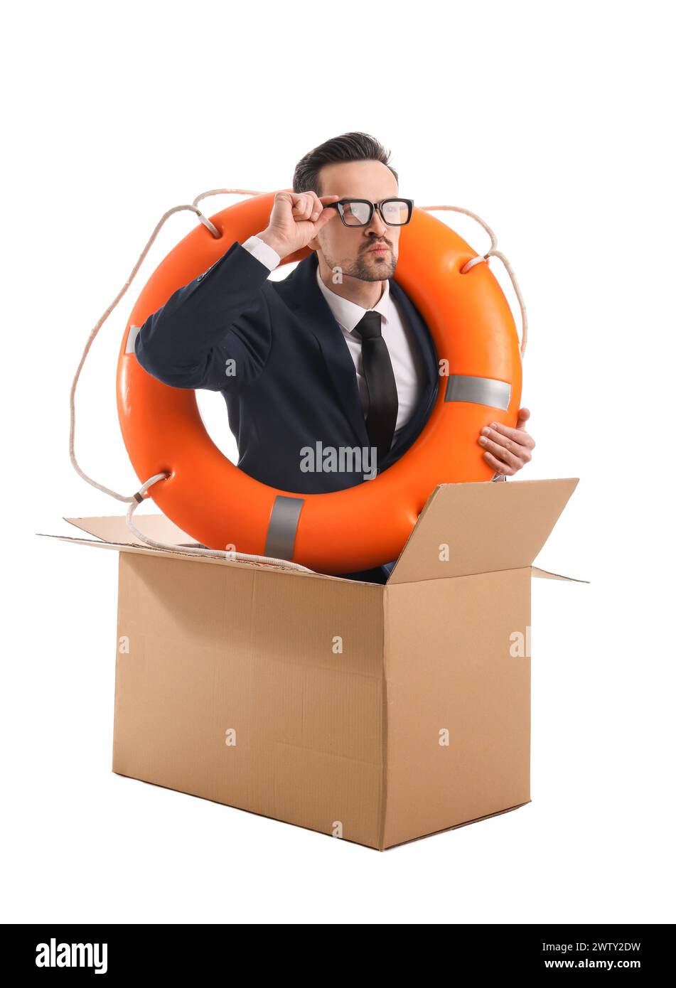 Funny businessman with ring buoy swimming in cardboard box on white background Stock Photo