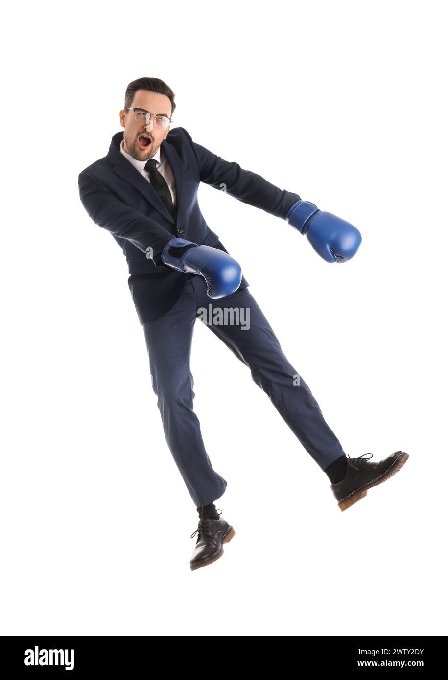 Funny businessman in boxing gloves jumping on white background Stock Photo